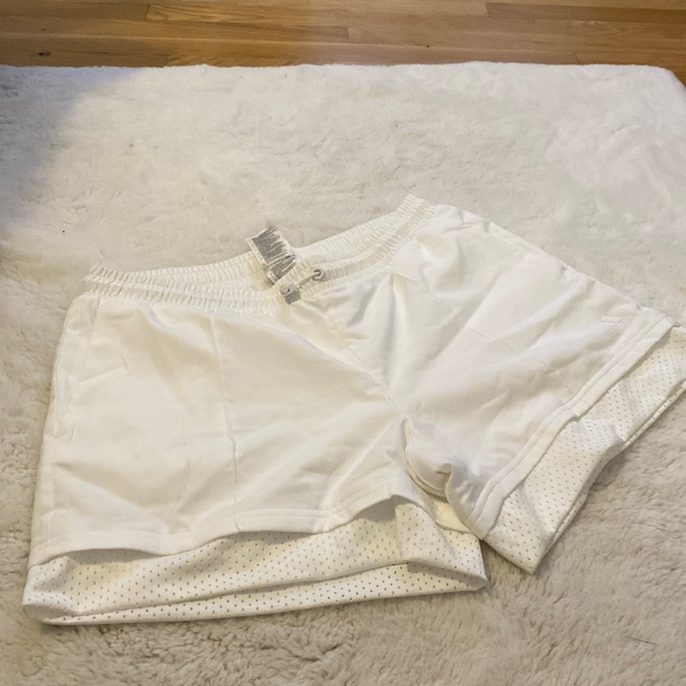 White Adidas active shorts.